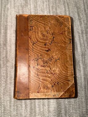 This book is an antique edition of Vanity Fair by William Makepeace Thackeray.